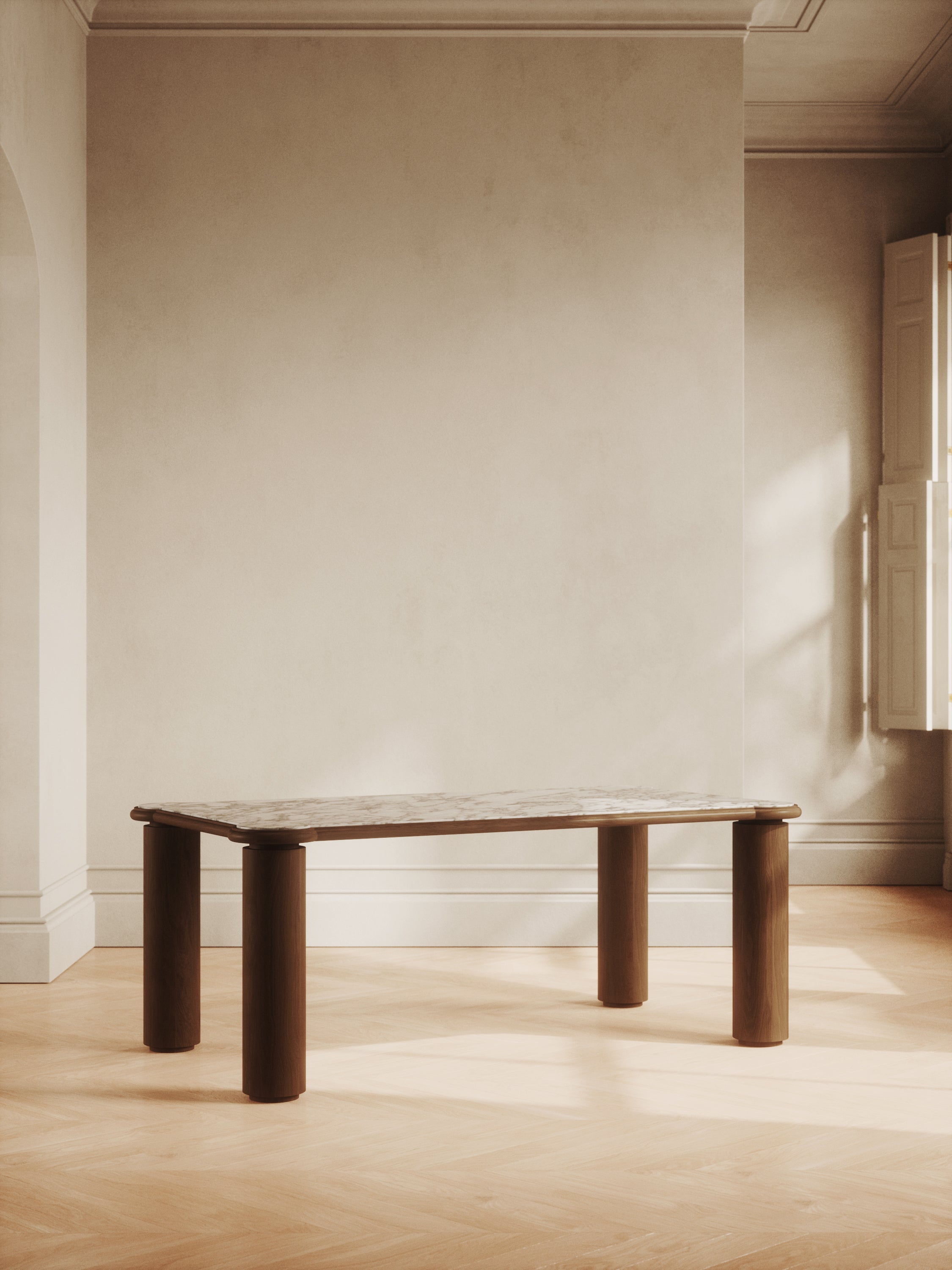 Minimalist dining table with sculptural legs and sleek design