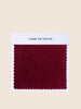 Jammy Red upholstered fabric with deep crimson and warm, bold undertones.