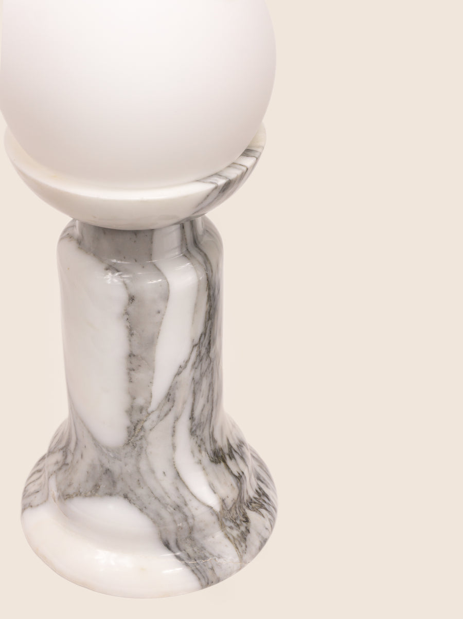 Sculptural Folsom lamp with marble base and glass or globe bulb options.