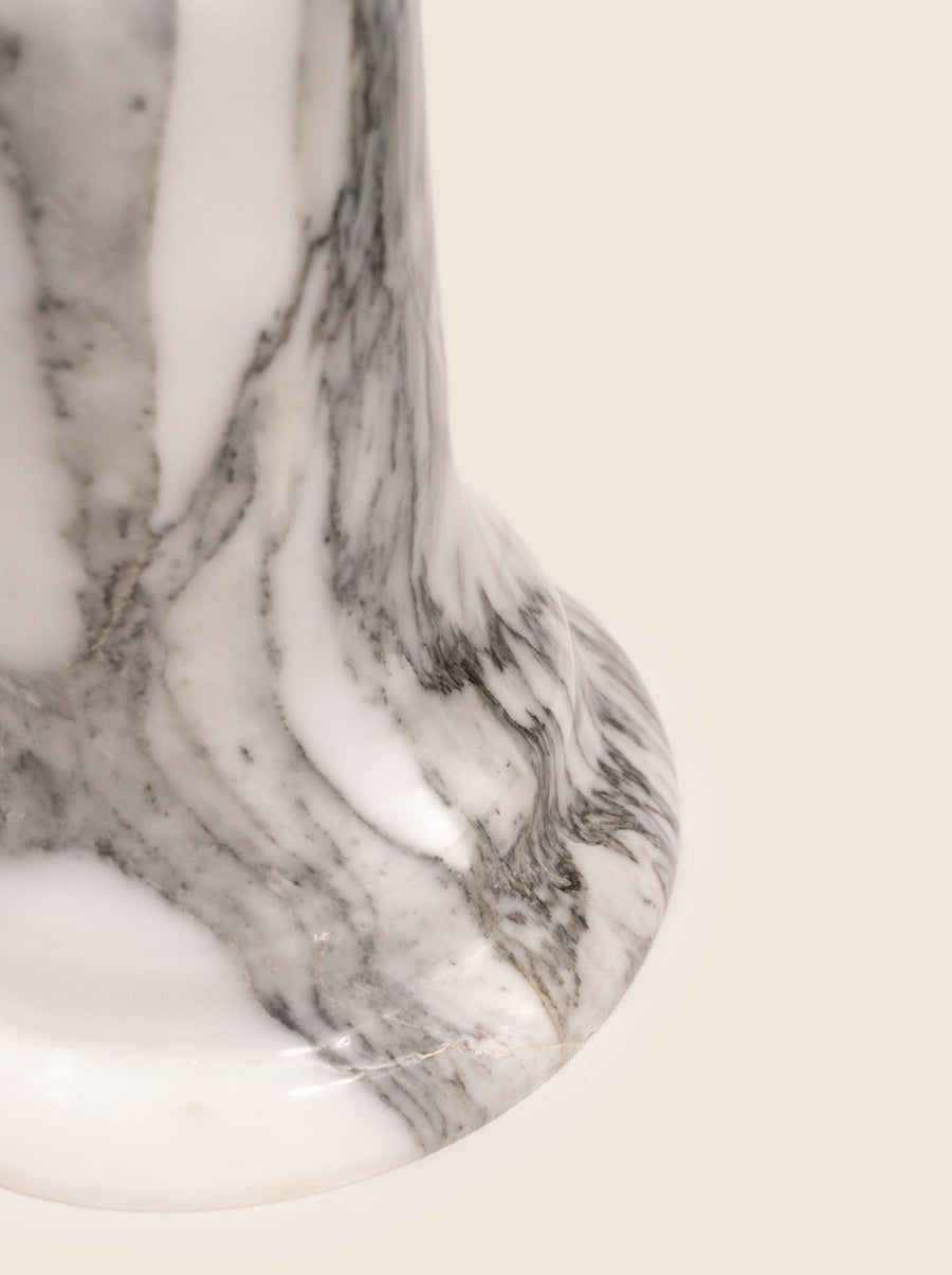 Folsom table lamp with sculptural marble base and glass or globe bulb.