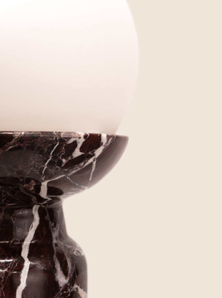 Folsom table lamp with sculptural marble base and glass or globe bulb