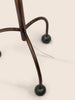 Tripod floor lamp with black frame and playful blue marble spheres