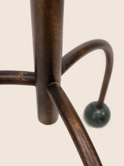 Tripod floor lamp with black frame and playful blue marble spheres