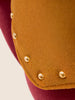 Tulip-inspired velvet ottoman with scalloped base and brass details