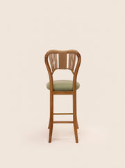 Taraval Counter Stool with handwoven backrest and sculptural wood legs – artisanal design by Home on Center