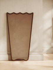 Mid-century wood mirror with scalloped top and rounded edges