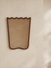 Scalloped wood mirror with wavy curves and mid-century charm
