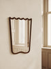Scalloped wood mirror with wavy curves and mid-century charm