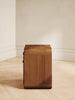 Mid-century wood nightstand with velvet drawers and rounded edges